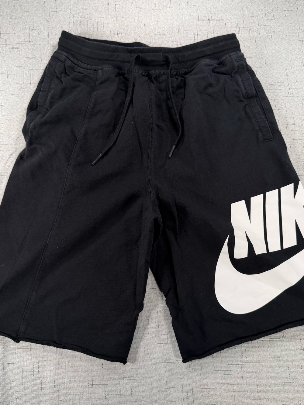 Nike Black Athletic Shorts with Large White Swoosh